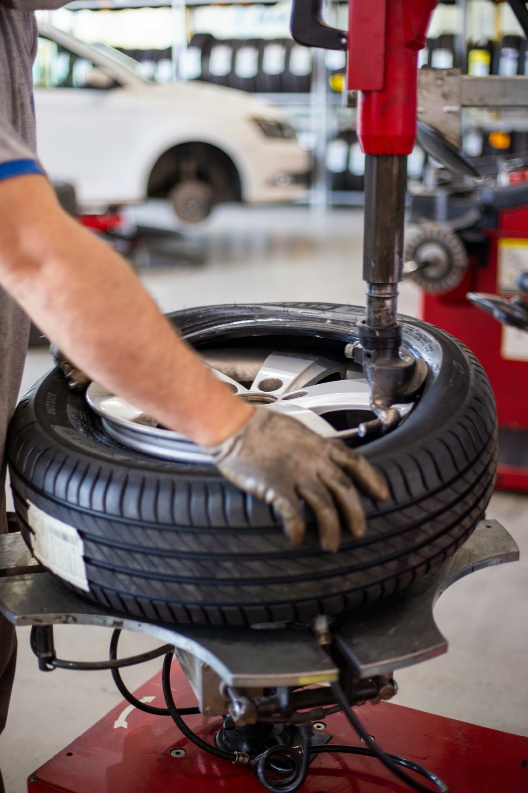 Tyre being fitted and inflated in the workshop